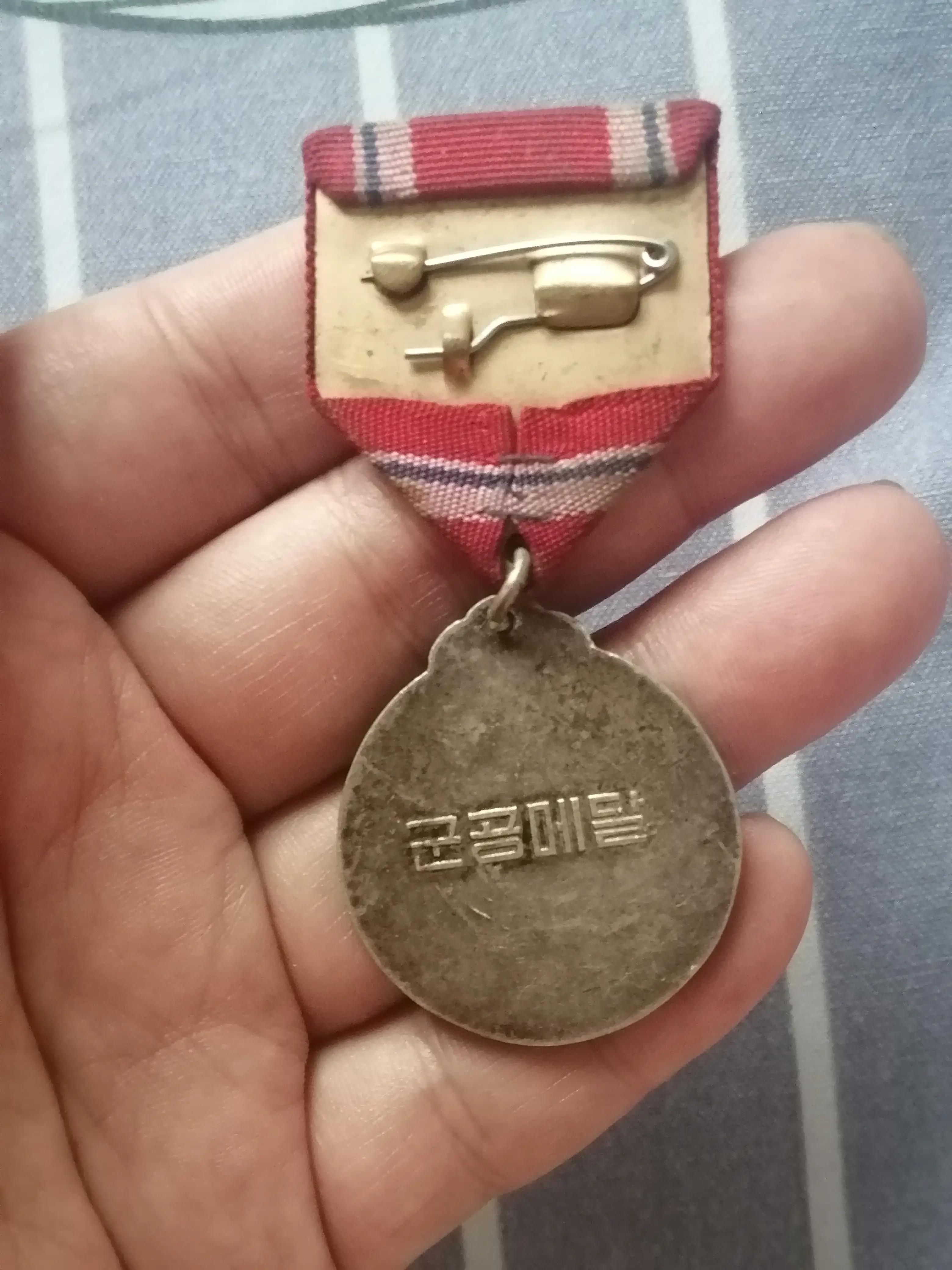 中国人民志愿军抗美援朝出国作战七十周年纪念章的寓意，抗美援朝七十周年纪念章，铭记历史，致敬英雄之魂